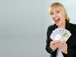 excited attractive blond girl British twenty pound notes