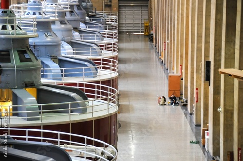 Photo: a man cleaning a large area of floor by machines a man cleaning a large area of floor by machines