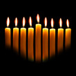 Hanukkah candles over black background with space for your text
