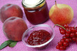 Glass bowl with peach jam and peach fruit,currant,jar Glass bowl with peach jam and peach fruit,currant,jar