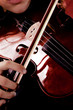 young woman plying violin, concert shoot