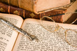 Silver Torah pointer lying on a jewish prayer book
