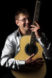 A series of photos of the person with a guitar