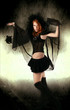 Portrait of a young beautiful witch in the black dress