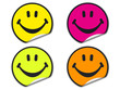 Four smiley face stickers in different colors. Four smiley face stickers in different colors.