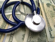 medical stethoscope on  background  dollar denominations