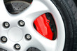 A close up shot of a sports car wheel and brakes