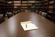 Conference room table and shelves of books