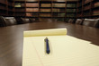 Conference room table and shelves of books