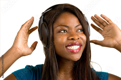 Photo: African American Lady Listening to Music with Headphones African American Lady Listening to Music with Headphones