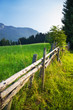 Alps traditional landscape. Small wooden fence.