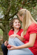 Photo: Mother and Daughter in Apple Orchard Mother and Daughter in Apple Orchard