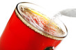 freshly brewed cup of tea with falling sugar granules