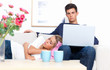 Happy young man sitting and woman sleeping on his lap Happy young man sitting and woman sleeping on his lap