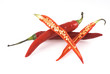 Tw red peppers unimpaired and one cut open.