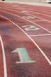 Lane markings at a wet running track.