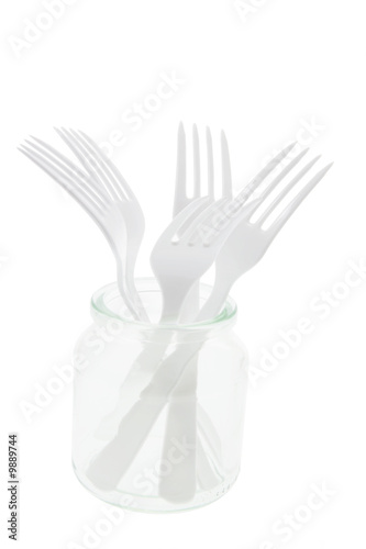Photo: Plastic Forks in Glass Jar on White Background Plastic Forks in Glass Jar on White Background