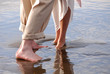 Bride and Grooms feet in the ocean