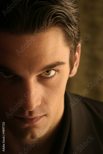 Photo: half face of a sinister young man with hair back half face of a sinister young man with hair back