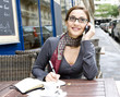 Photo: An attractive woman in an outdoors cafe An attractive woman in an outdoors cafe