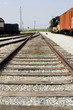 Railroad track with trains on side