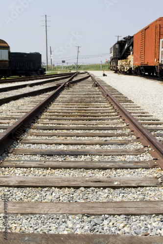 Photo: Railroad track with trains on side Railroad track with trains on side