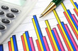 Colorful business chart, calculator and pen