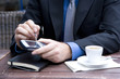 Photo: Businessman in an outside cafe macro Businessman in an outside cafe macro