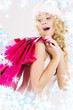picture of cheerful santa helper girl with shopping bags