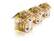 three houses built of euro bills with reflection on white
