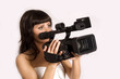 pretty girl holding HDV camcorder isolated on white pretty girl holding HDV camcorder isolated on white