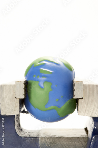 Model Earth Squeezed In Vice