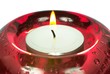 Red glass candlesticks width lightening candle close-up image Red glass candlesticks width lightening candle close-up image