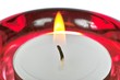 Red glass candlesticks width lightening candle close-up image Red glass candlesticks width lightening candle close-up image