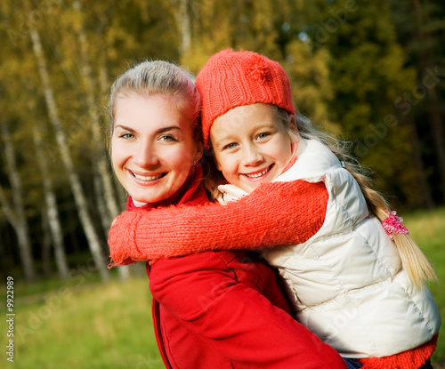 Mother and daughter outdoors