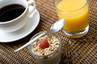 Fresh coffee, orange juice, muesli and yogurt