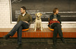 couple in underground station with their dog,