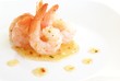 Shrimp with tails in herb oil salad dressing or sauce