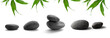 zen-like stones. pebbles and bamboo leaves on white background