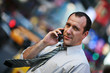 Businessman talking on cellular phone in New York city