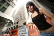 Beautiful girl in New York City. Wide angle view from below. Beautiful girl in New York City. Wide angle view from below.