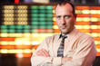 Businessman over stock exchange background