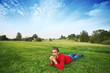 Man lying on green grass in beautiful landscape