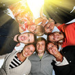 Group of happy young people in circle outdoors