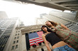 Two young women near New York Stock Exchange