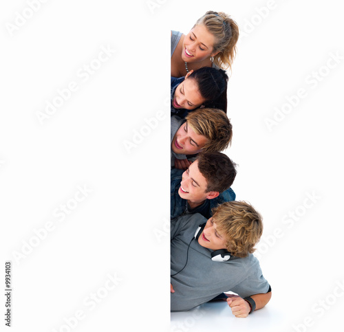 Photo: Closeup portrait of young friends looking at copyspace Closeup portrait of young friends looking at copyspace