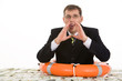Image of crying businessman having buoy