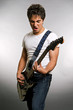 emotional man playing on guitar over grey background