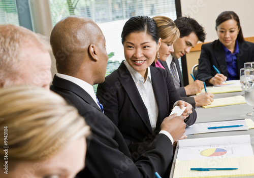 Photo: Businessman offering business card to colleague Businessman offering business card to colleague