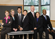 Multi-ethnic co-workers posing in conference room